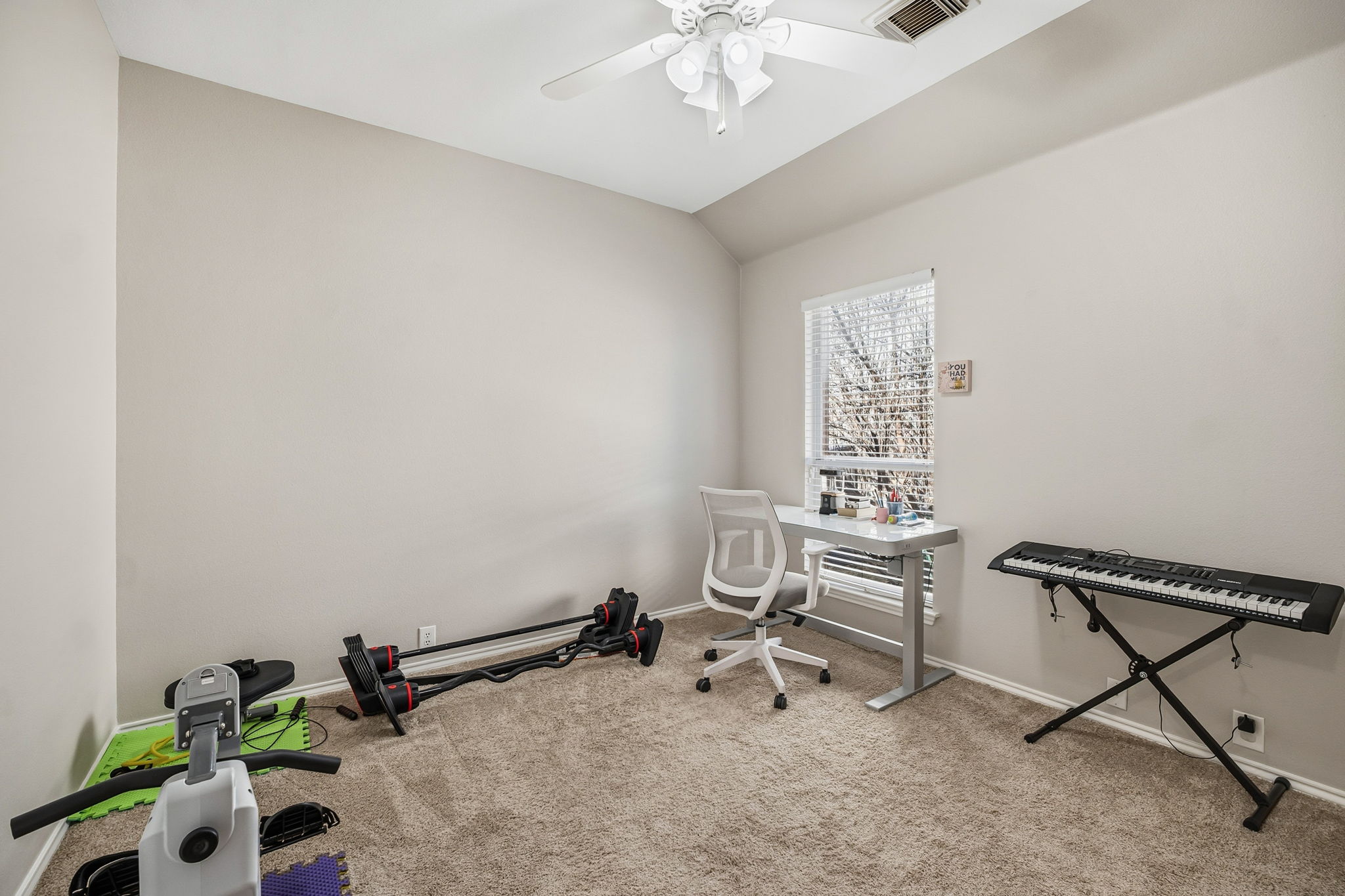 2112 Bandera Path Round Rock, TX 78665 - Photo 25 of 34 a view of a room with a window and gym equipment