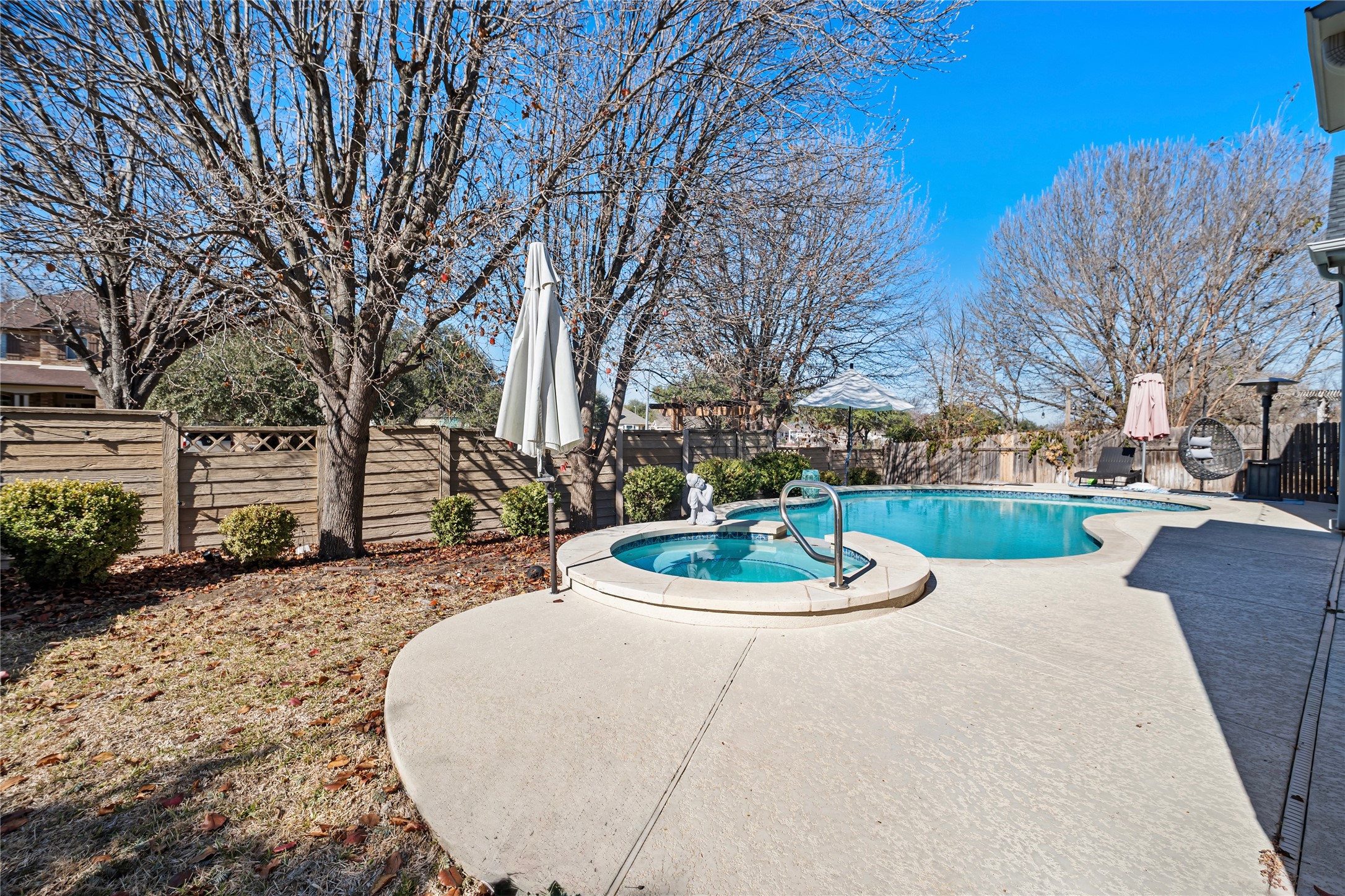 2112 Bandera Path Round Rock, TX 78665 - Photo 31 of 34 a backyard of a house with a fountain table and chairs