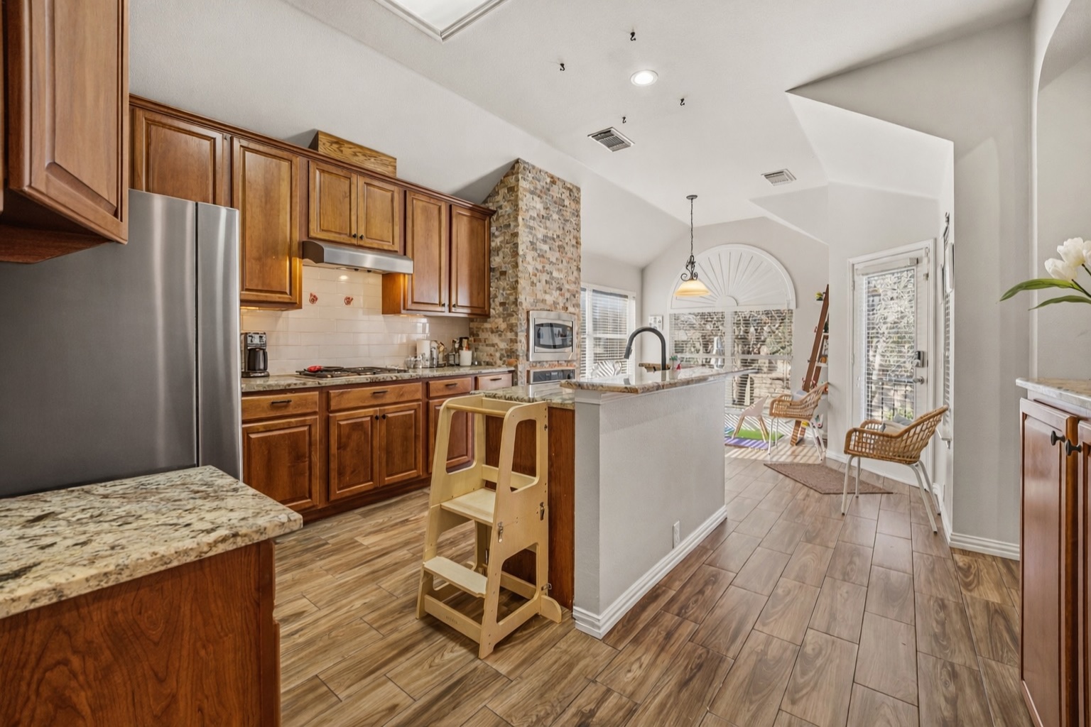 2112 Bandera Path Round Rock, TX 78665 - Photo 8 of 34 a kitchen with cabinets and wooden floor