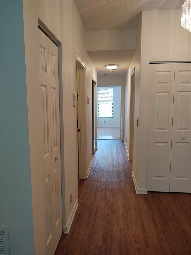 5801 Coach House Circle, Unit B Boca Raton, FL 33486 - Photo 14 of 39 Hallway leading to bedrooms