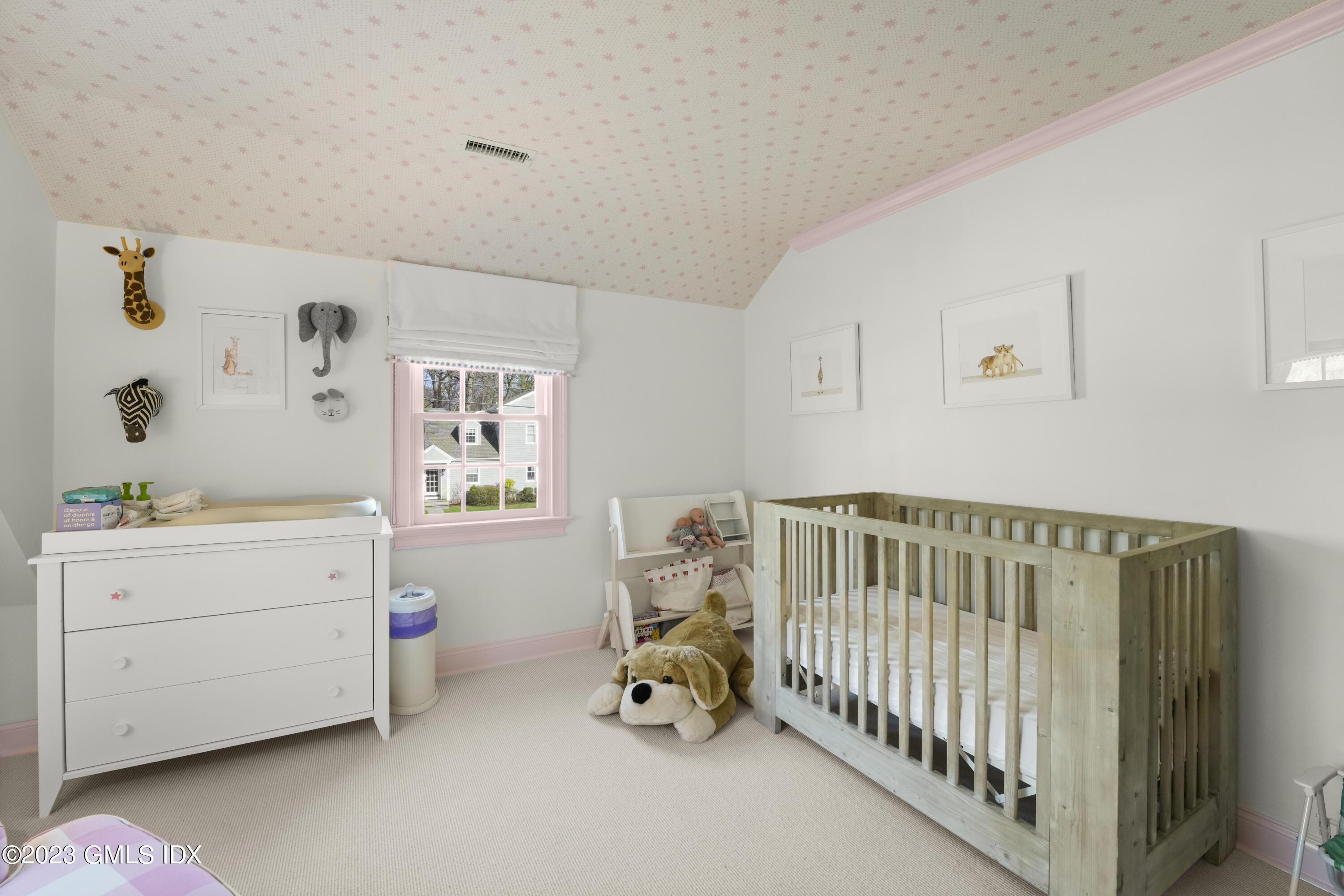 46 Terrace Avenue Riverside, CT 06878 - Photo 12 of 17 a bedroom with a baby bed baby crib and a dresser