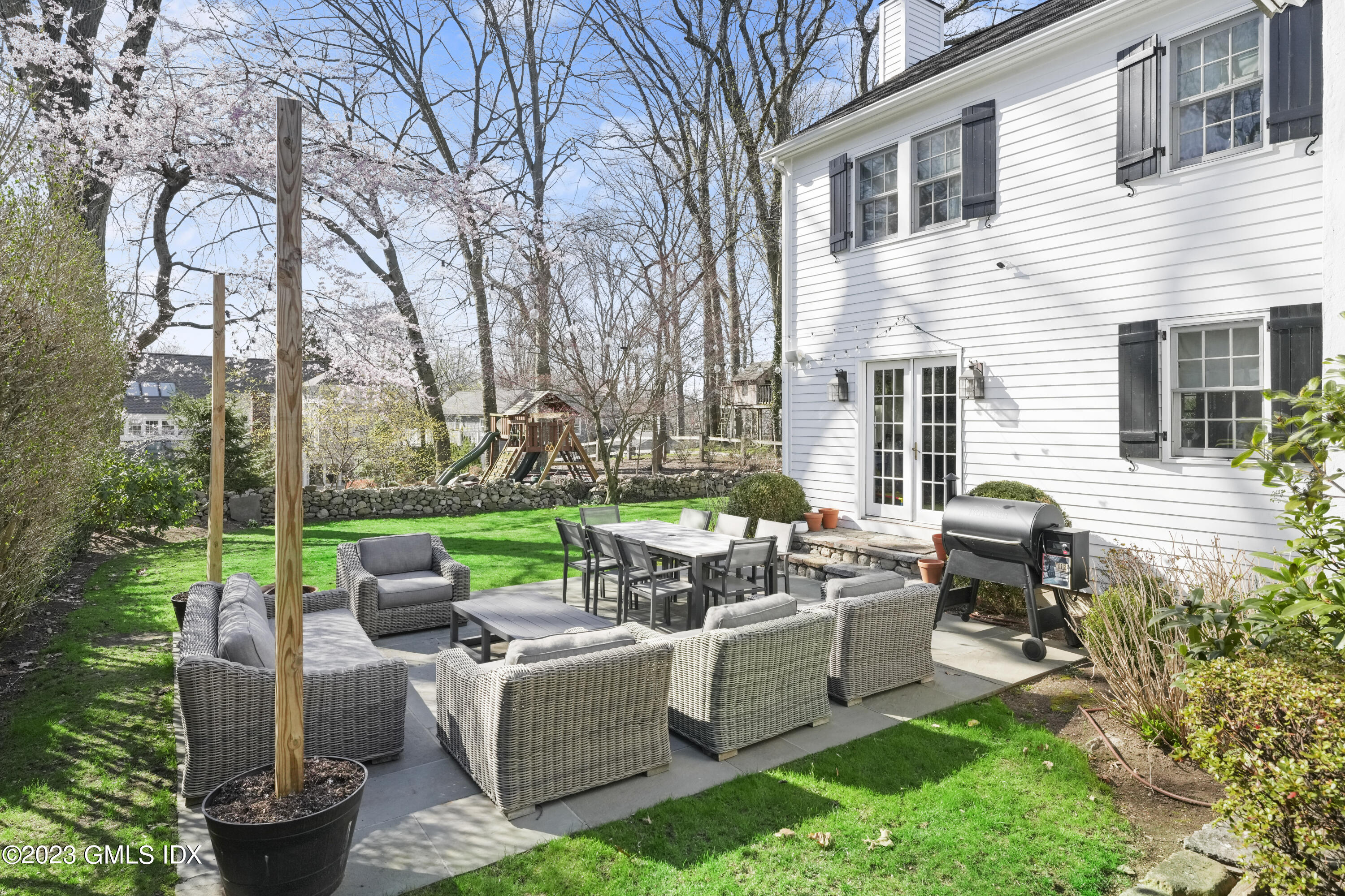 46 Terrace Avenue Riverside, CT 06878 - Photo 13 of 17 a backyard of a house with outdoor seating