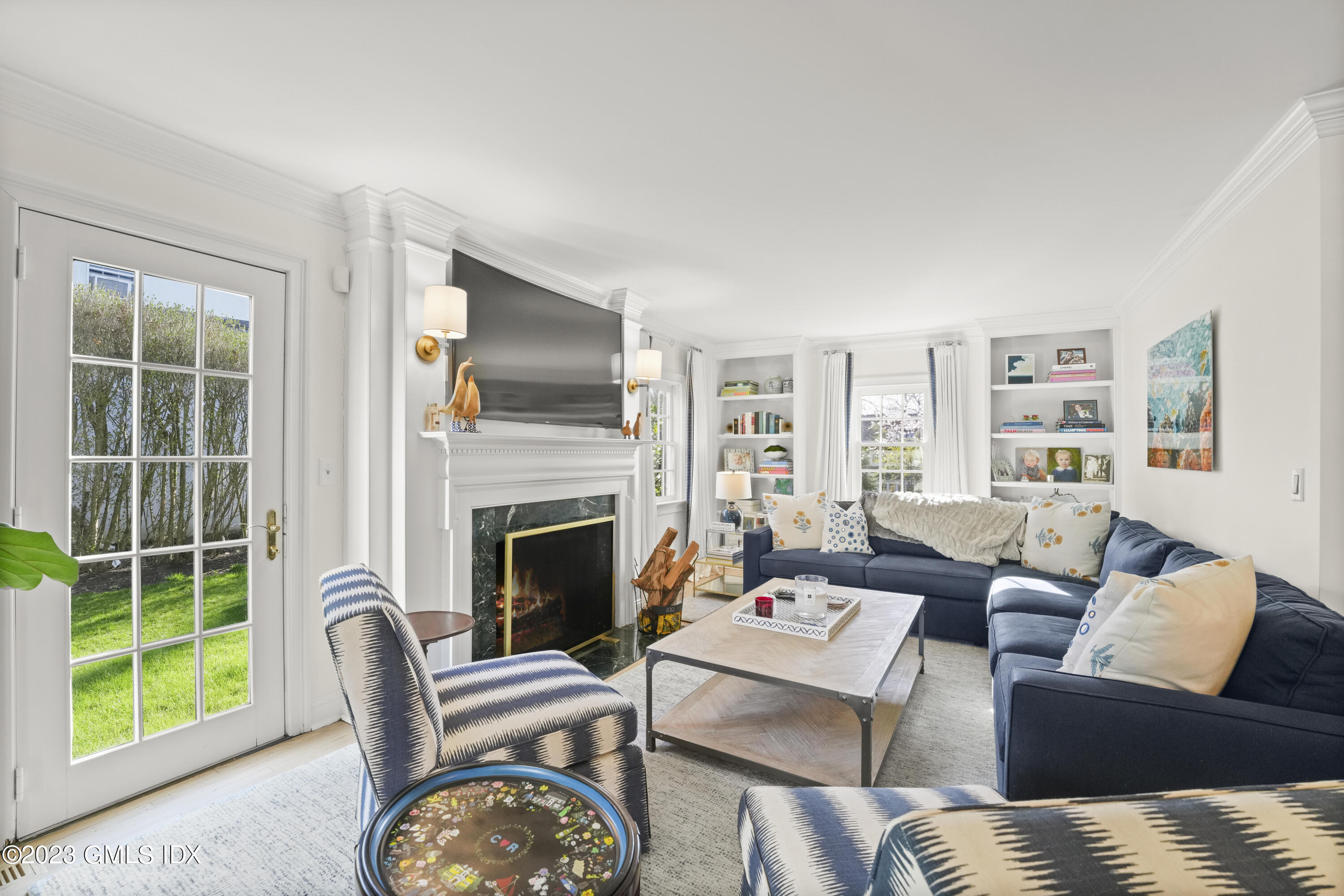 46 Terrace Avenue Riverside, CT 06878 - Photo 3 of 17 a living room with furniture a fireplace and a large window
