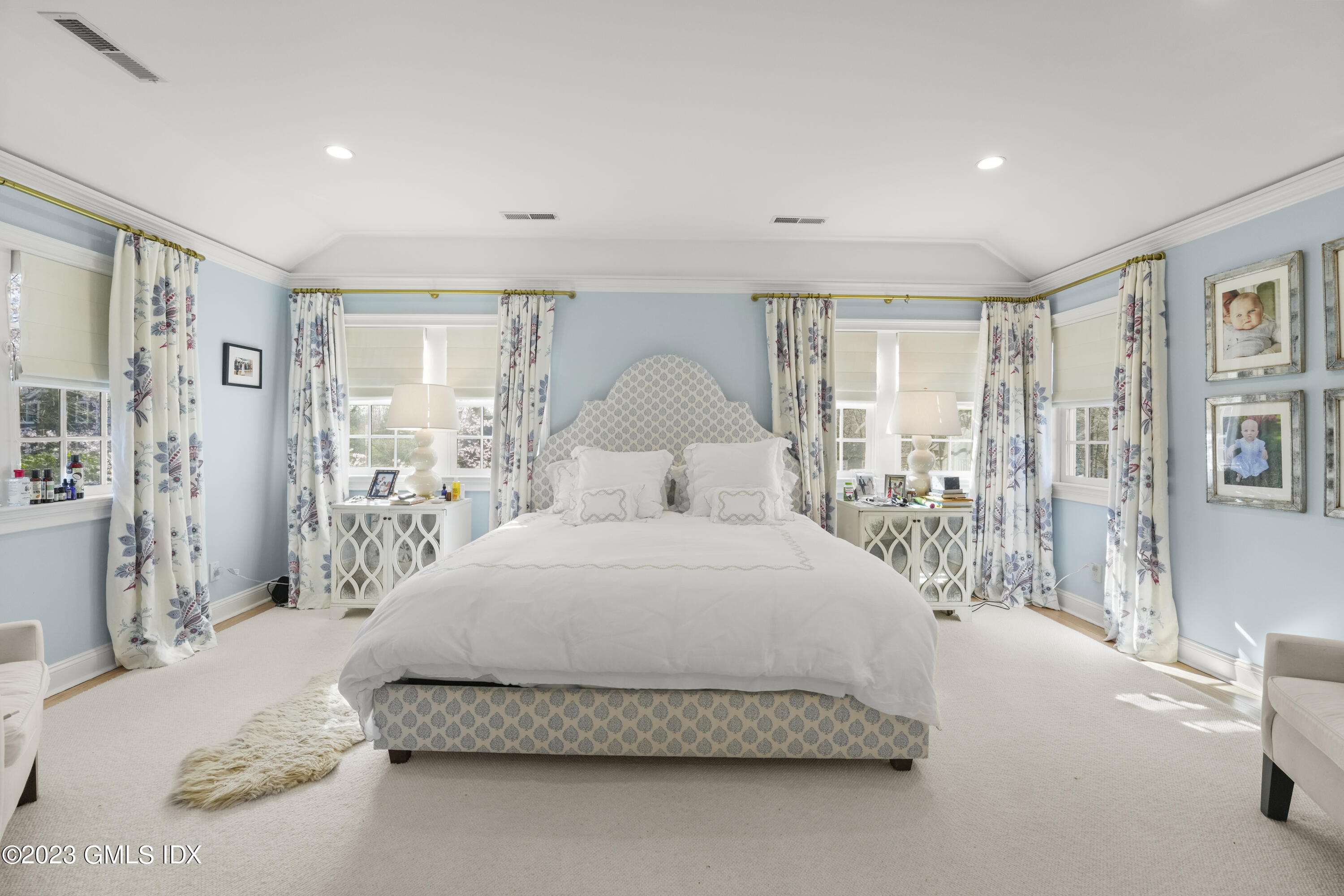 46 Terrace Avenue Riverside, CT 06878 - Photo 9 of 17 a bedroom with a large bed and a chandelier