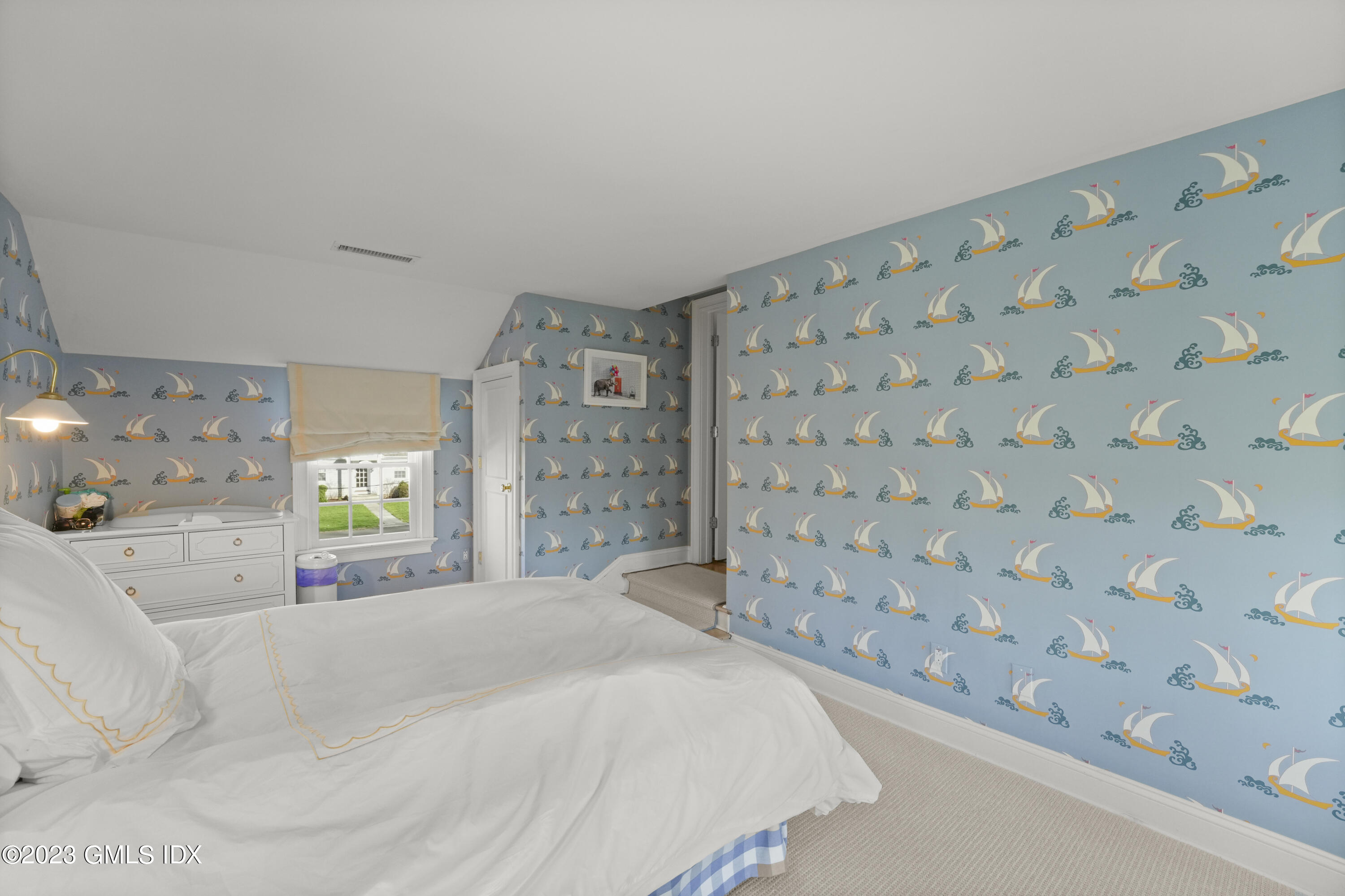 46 Terrace Avenue Riverside, CT 06878 - Photo 10 of 17 a bedroom with a bed and a lamp