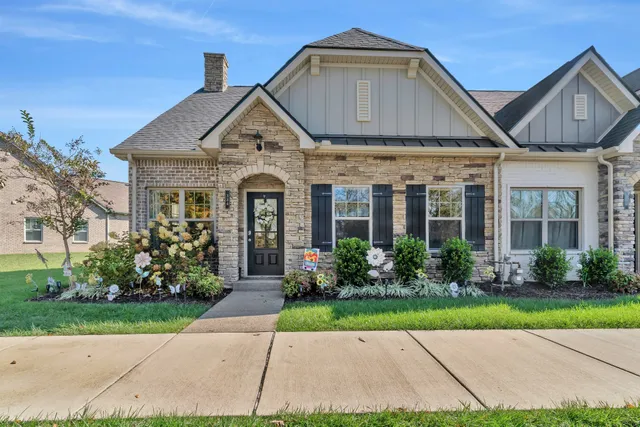 a front view of a house with garden