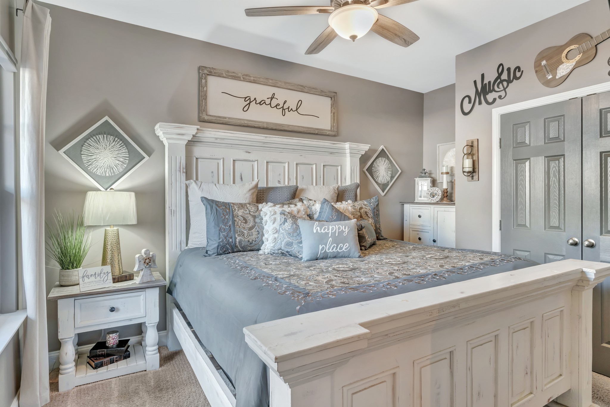 334 Buckner Cir Mount Mount Juliet, TN 37122 - Photo 19 of 44 a bedroom with a large bed and a chandelier