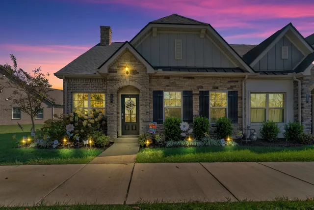 a front view of a house with garden