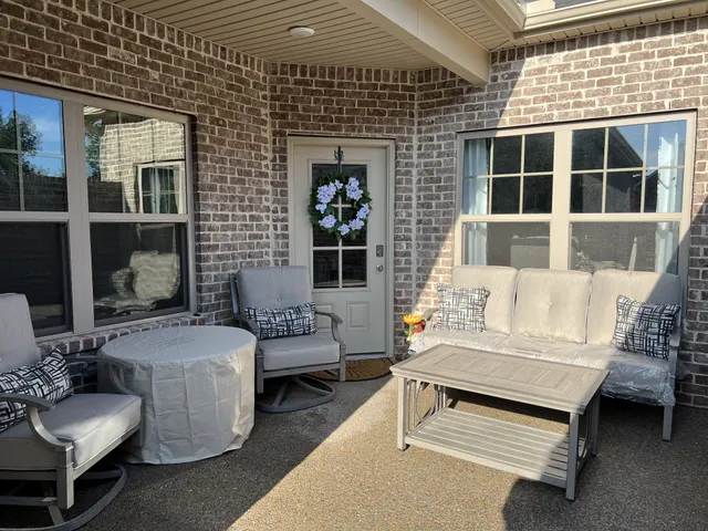 a outdoor living space with furniture and a potted plant