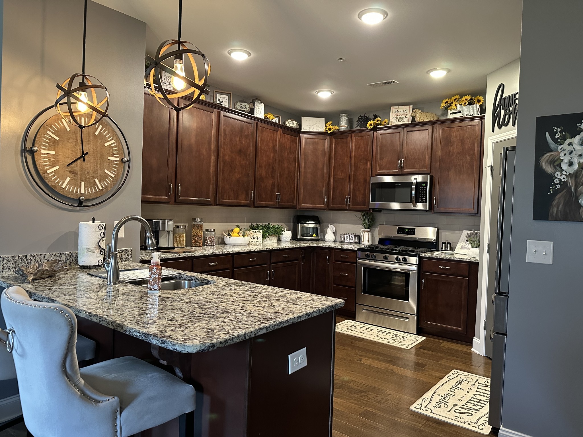 334 Buckner Cir Mount Mount Juliet, TN 37122 - Photo 9 of 44 a kitchen with kitchen island granite countertop a stove top oven a sink and dishwasher