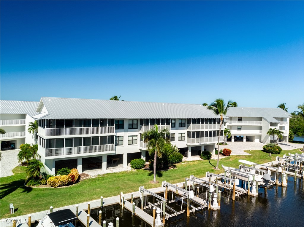 a view of a swimming pool and lounge chairs