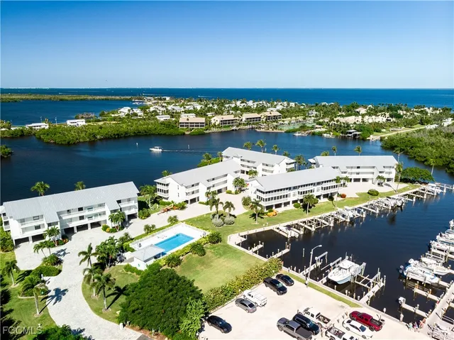 an aerial view of a house with a ocean view