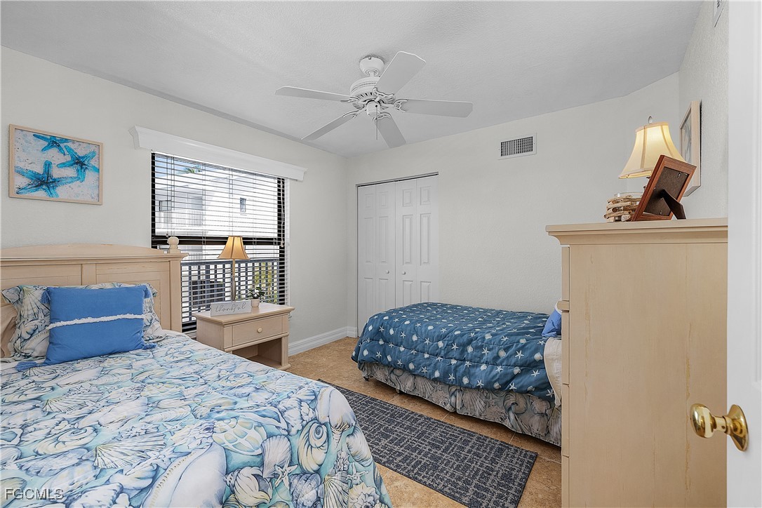 16641 Stringfellow Road, Unit 502 Bokeelia, FL 33922 - Photo 23 of 43 a bedroom with furniture and window