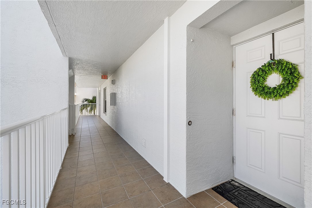 16641 Stringfellow Road, Unit 502 Bokeelia, FL 33922 - Photo 3 of 43 a hallway with a potted plant
