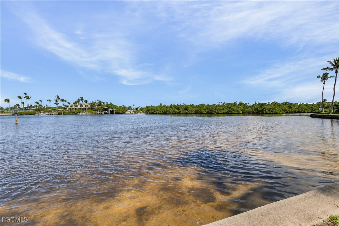 16641 Stringfellow Road, Unit 502 Bokeelia, FL 33922 - Photo 39 of 43 a view of a lake with houses in the background