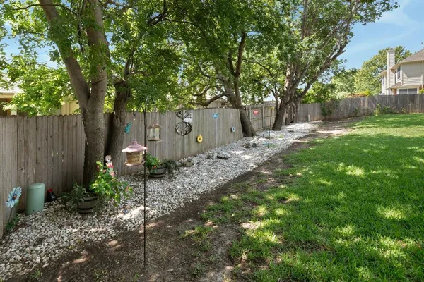 a view of a house with backyard porch and sitting area