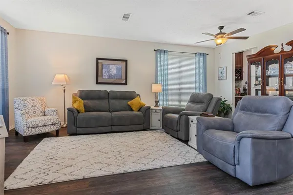 a living room with furniture and a rug