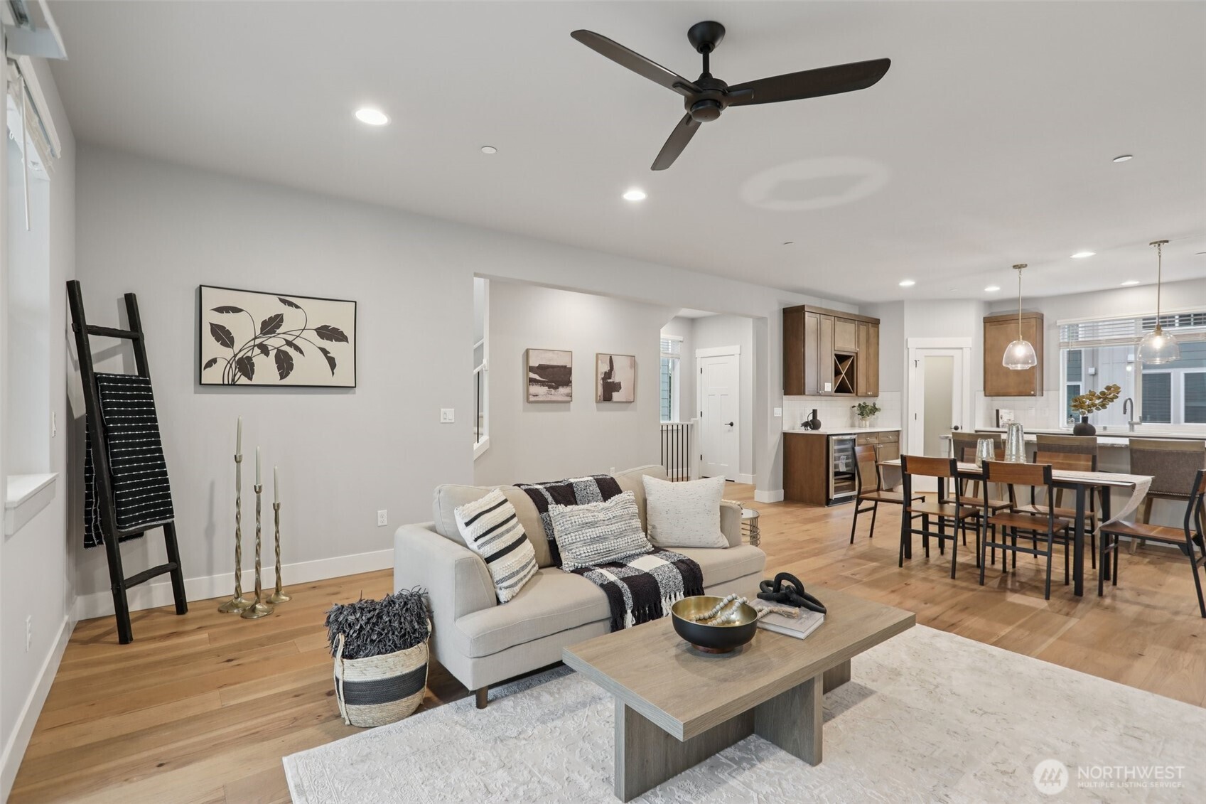 18 160th Place Southeast Bothell, WA 98012 - Photo 13 of 32 a living room with furniture and a dining table with wooden floor