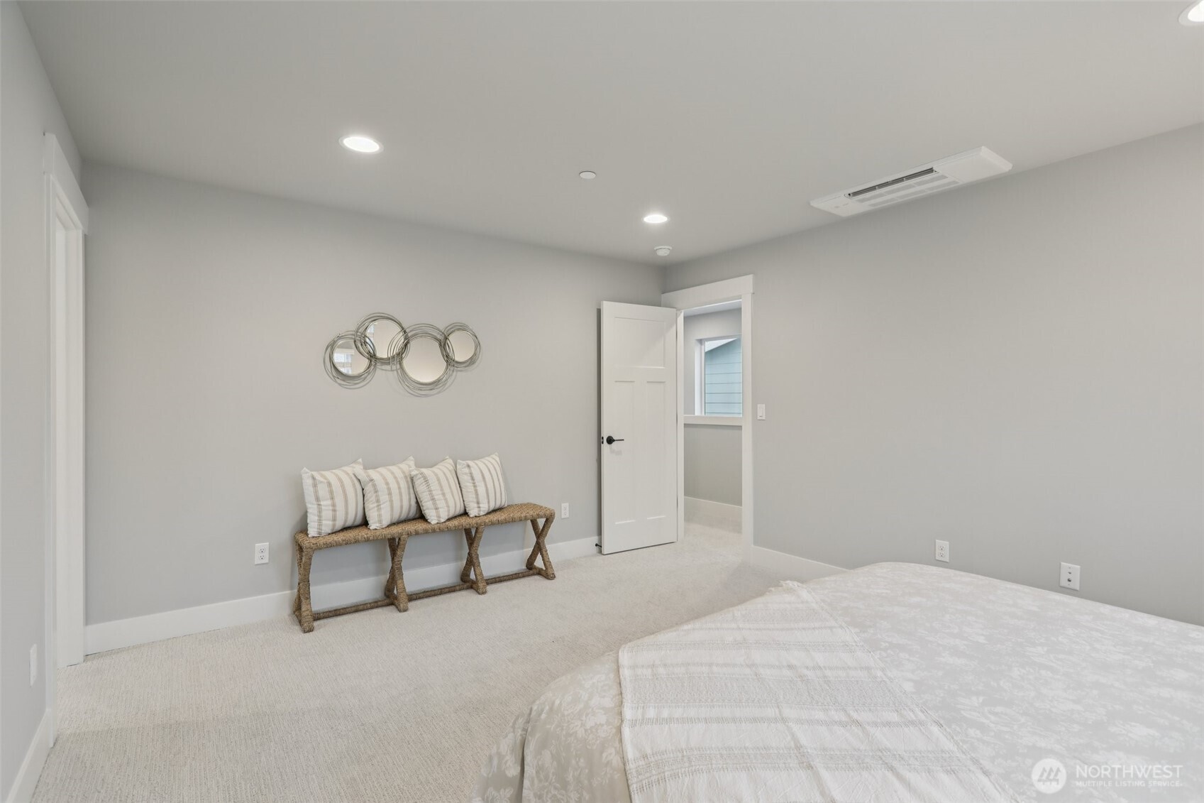 18 160th Place Southeast Bothell, WA 98012 - Photo 17 of 32 a spacious bedroom with a bed and white walls