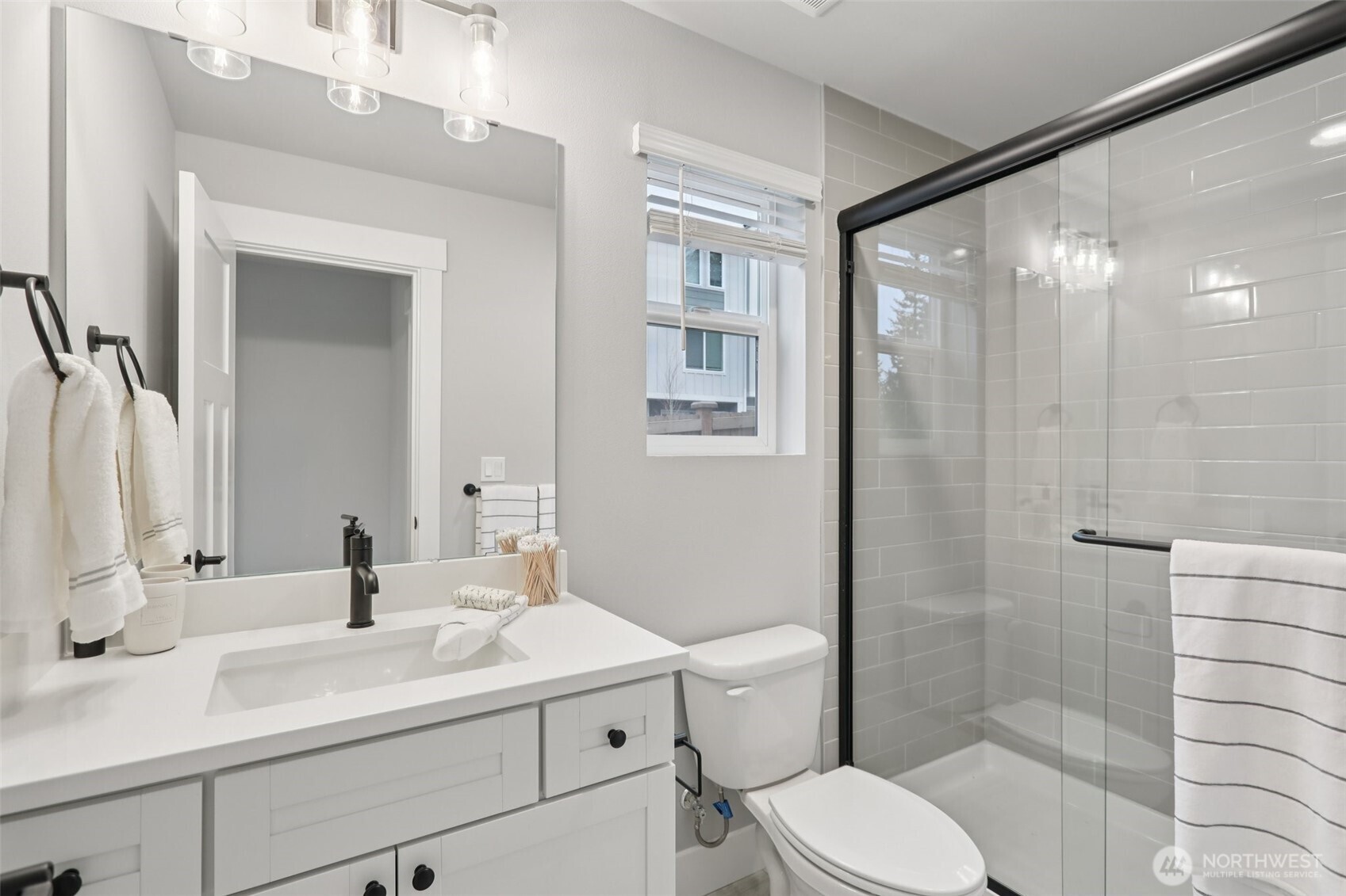 18 160th Place Southeast Bothell, WA 98012 - Photo 28 of 32 a bathroom with a sink a toilet and shower