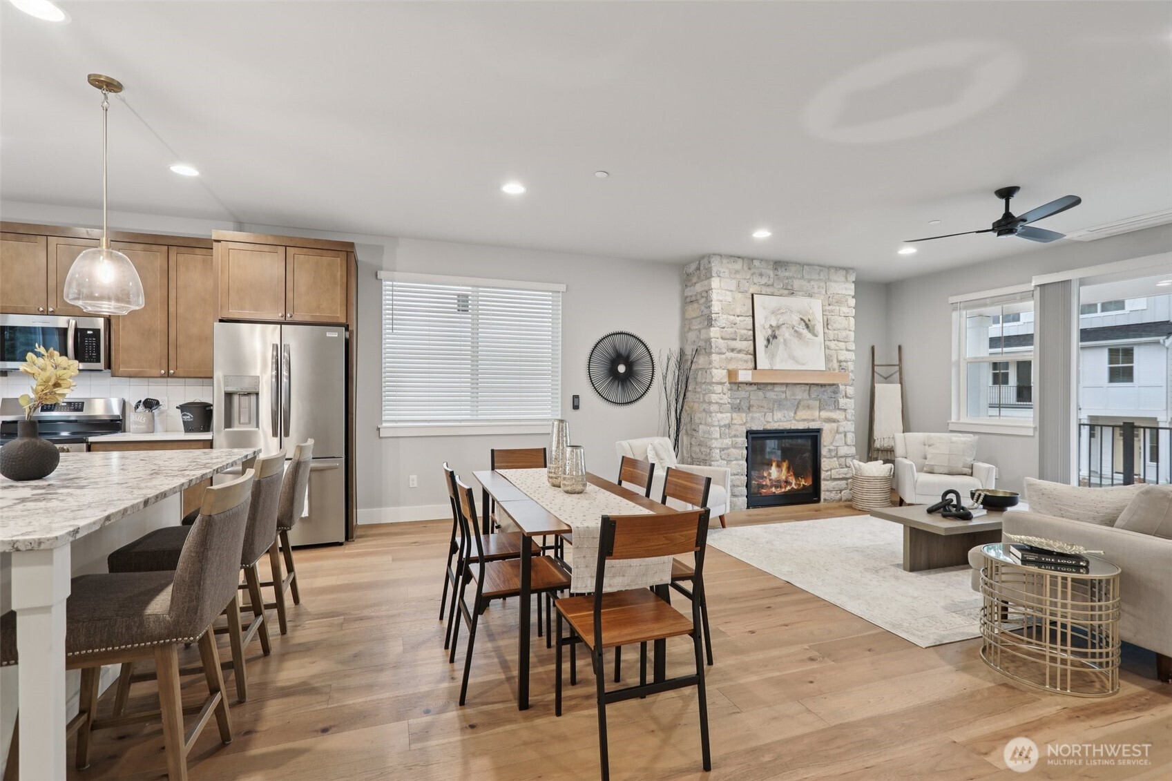 18 160th Place Southeast Bothell, WA 98012 - Photo 3 of 32 a view of a dining room with furniture window and wooden floor