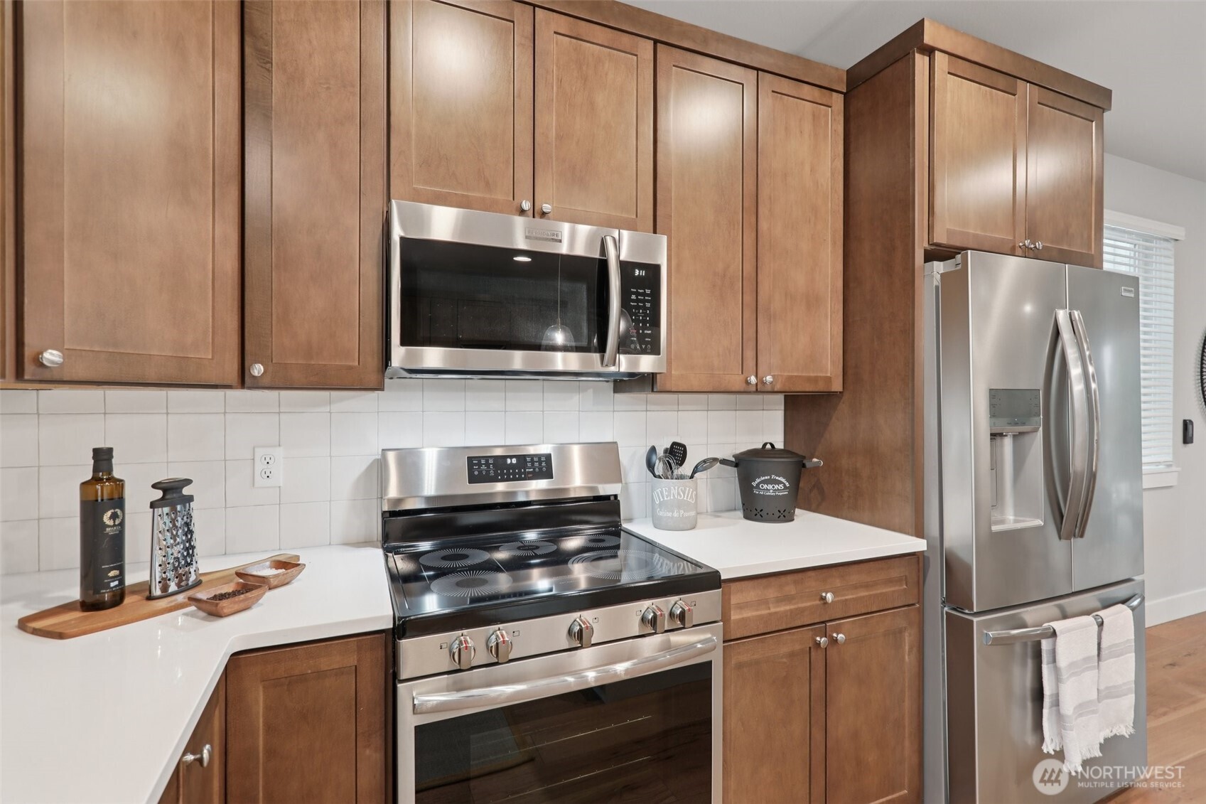 18 160th Place Southeast Bothell, WA 98012 - Photo 7 of 32 a kitchen with stainless steel appliances granite countertop a refrigerator a stove and a sink