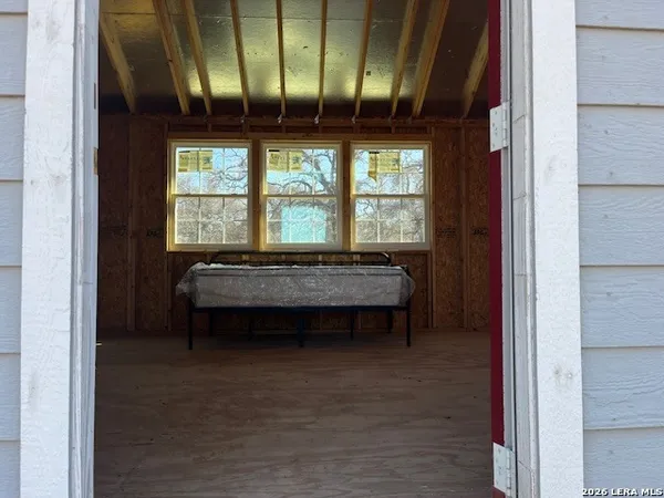 a bathroom with a sink and a bathtub next to a window