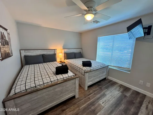 a bedroom with furniture and window