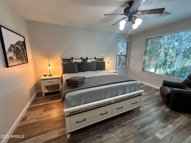 a bedroom with a bed and a couch