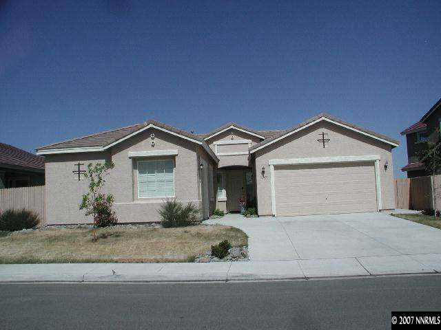 10431 Blockade Drive Reno, NV 89521 - Photo 1 of 7 a view of a house with a yard and garage