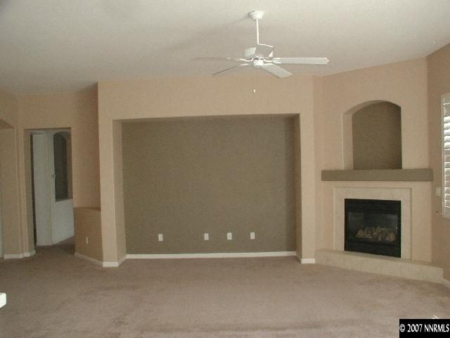 10431 Blockade Drive Reno, NV 89521 - Photo 4 of 7 a view of an empty room with chandelier fan