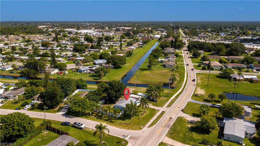 11 Alabama Road South Lehigh Acres, FL 33936 - Photo 28 of 30 an aerial view of residential houses with outdoor space