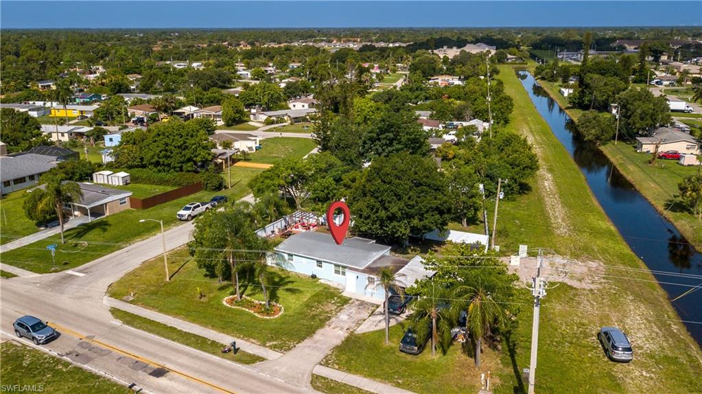 11 Alabama Road South Lehigh Acres, FL 33936 - Photo 3 of 30 an aerial view of residential houses with outdoor space