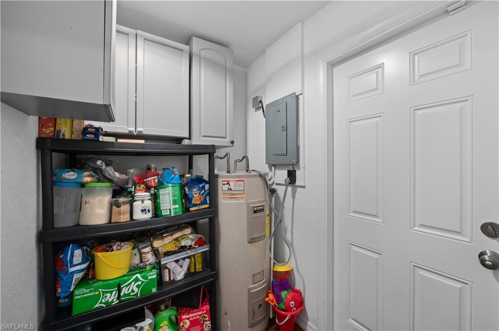 11 Alabama Road South Lehigh Acres, FL 33936 - Photo 8 of 30 a store room with storage and utility