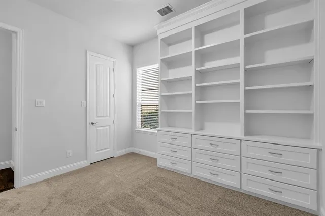 a bathroom with a sink vanity and a mirror