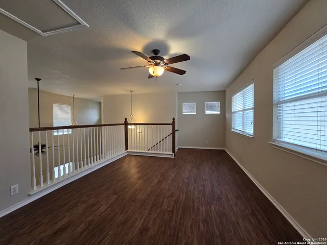 a kitchen with stainless steel appliances a sink a stove cabinets and a kitchen island