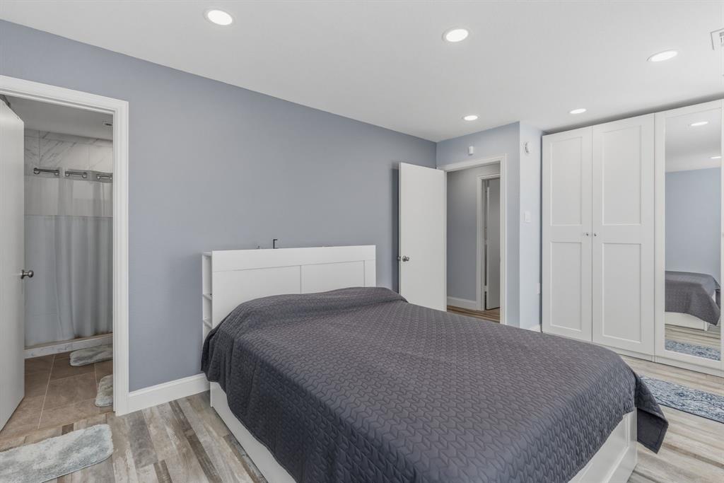 619 Rs County Road 3350 Emory, TX 75440 - Photo 15 of 40 a bedroom with a bed and a mirror