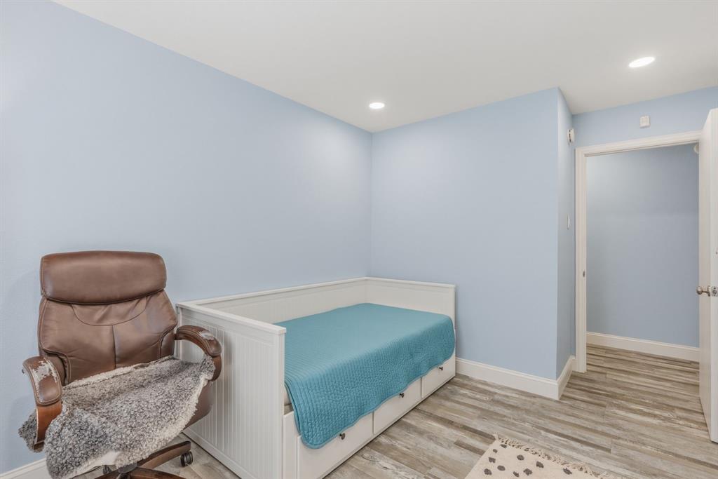 619 Rs County Road 3350 Emory, TX 75440 - Photo 19 of 40 a bedroom with a bed and a chair