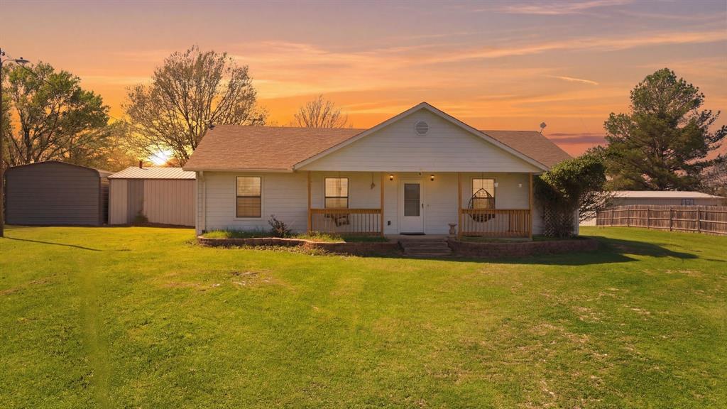 619 Rs County Road 3350 Emory, TX 75440 - Photo 2 of 40 a front view of house with swimming pool and yard with green space
