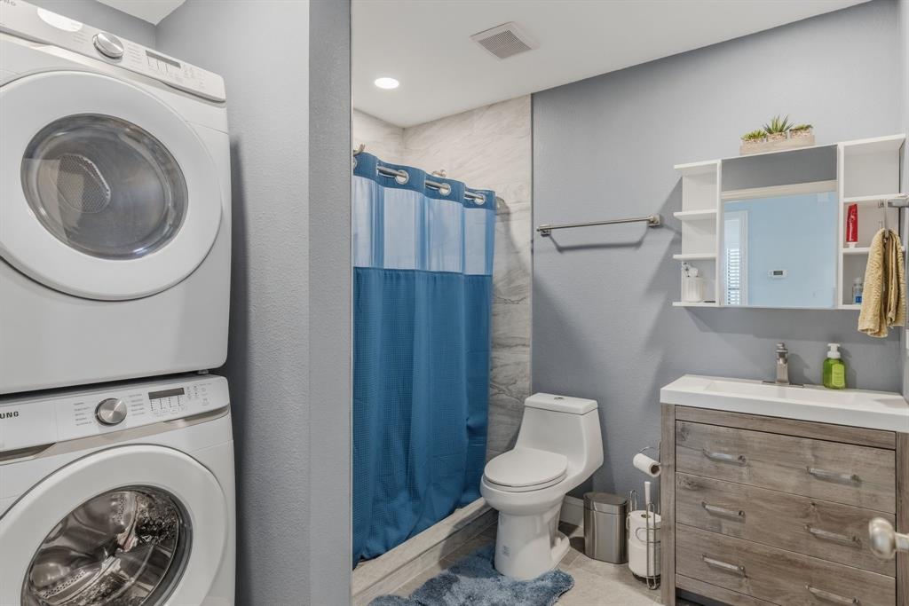619 Rs County Road 3350 Emory, TX 75440 - Photo 22 of 40 a bathroom with a toilet sink vanity and mirror