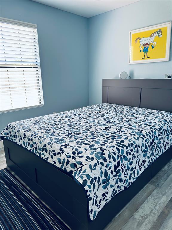 619 Rs County Road 3350 Emory, TX 75440 - Photo 23 of 40 a bed sitting in a bedroom next to a window