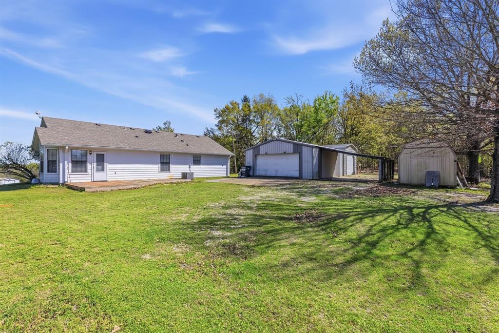 619 Rs County Road 3350 Emory, TX 75440 - Photo 3 of 40 a view of a house with a big yard