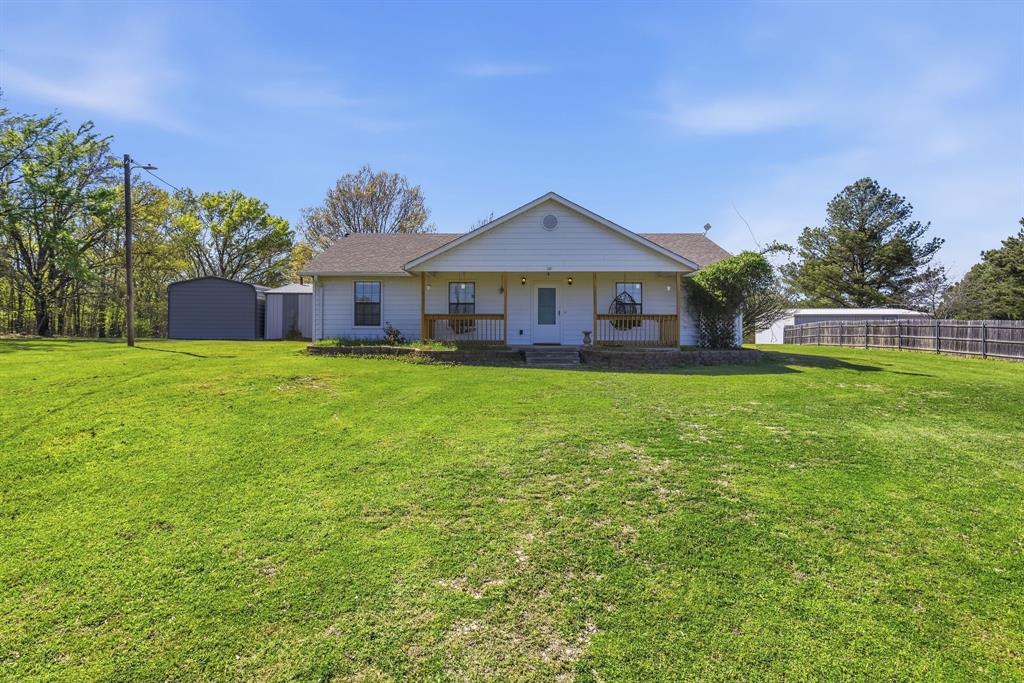 619 Rs County Road 3350 Emory, TX 75440 - Photo 31 of 40 a view of a house with a yard and sitting area