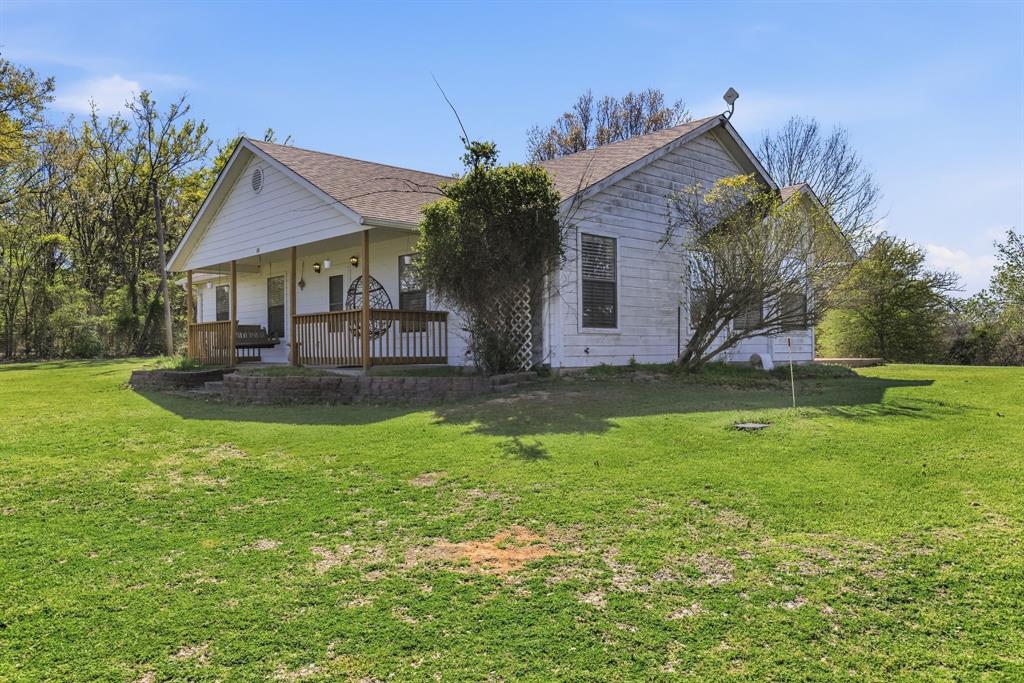 619 Rs County Road 3350 Emory, TX 75440 - Photo 33 of 40 a front view of house with backyard and green space