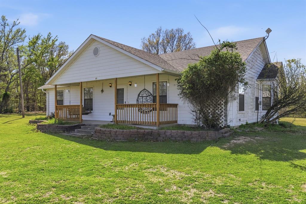 619 Rs County Road 3350 Emory, TX 75440 - Photo 34 of 40 a view of a house with a yard
