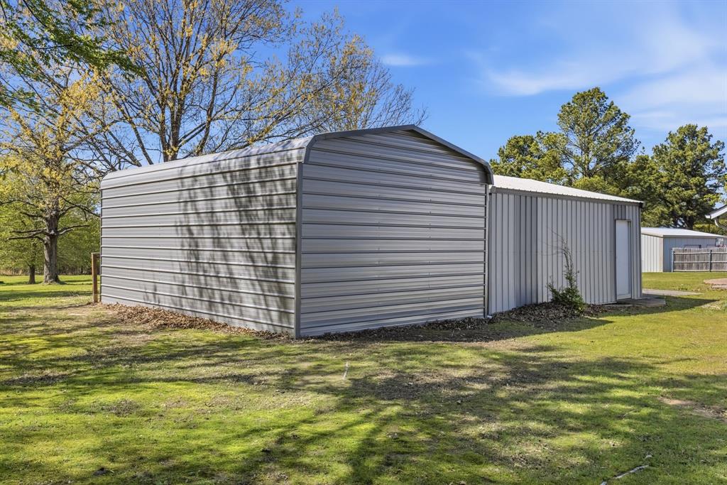 619 Rs County Road 3350 Emory, TX 75440 - Photo 38 of 40 a view of a backyard of the house