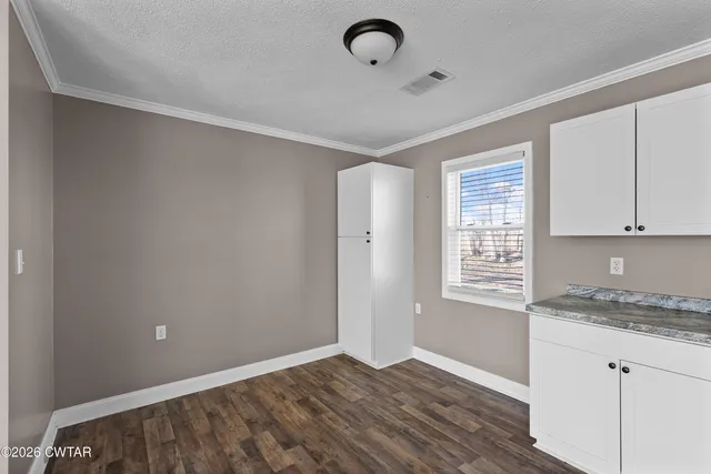 a bathroom with a shower and a sink