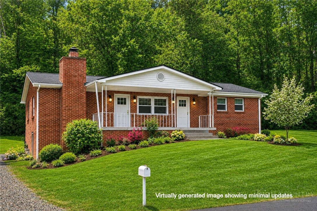 2510 Rich Hill Road Creston, NC 28615 - Photo 2 of 38 a front view of a house with a yard and trees