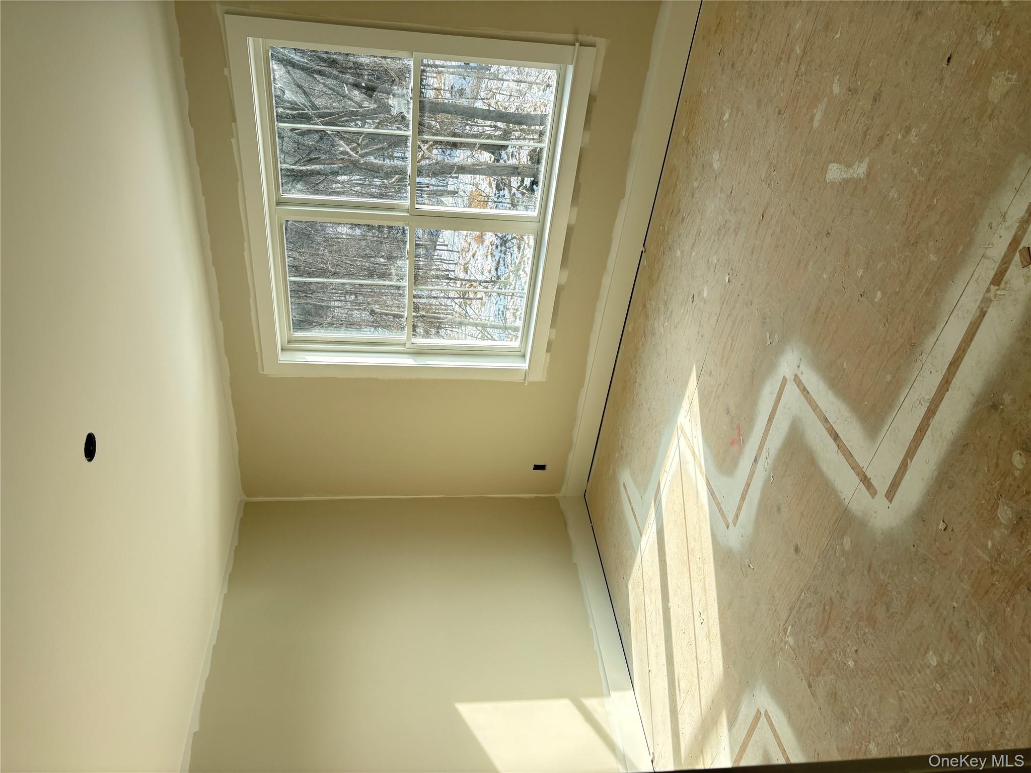 466 Wheeler Road Florida, NY 10921 - Photo 18 of 21 an empty room with a empty space and a window