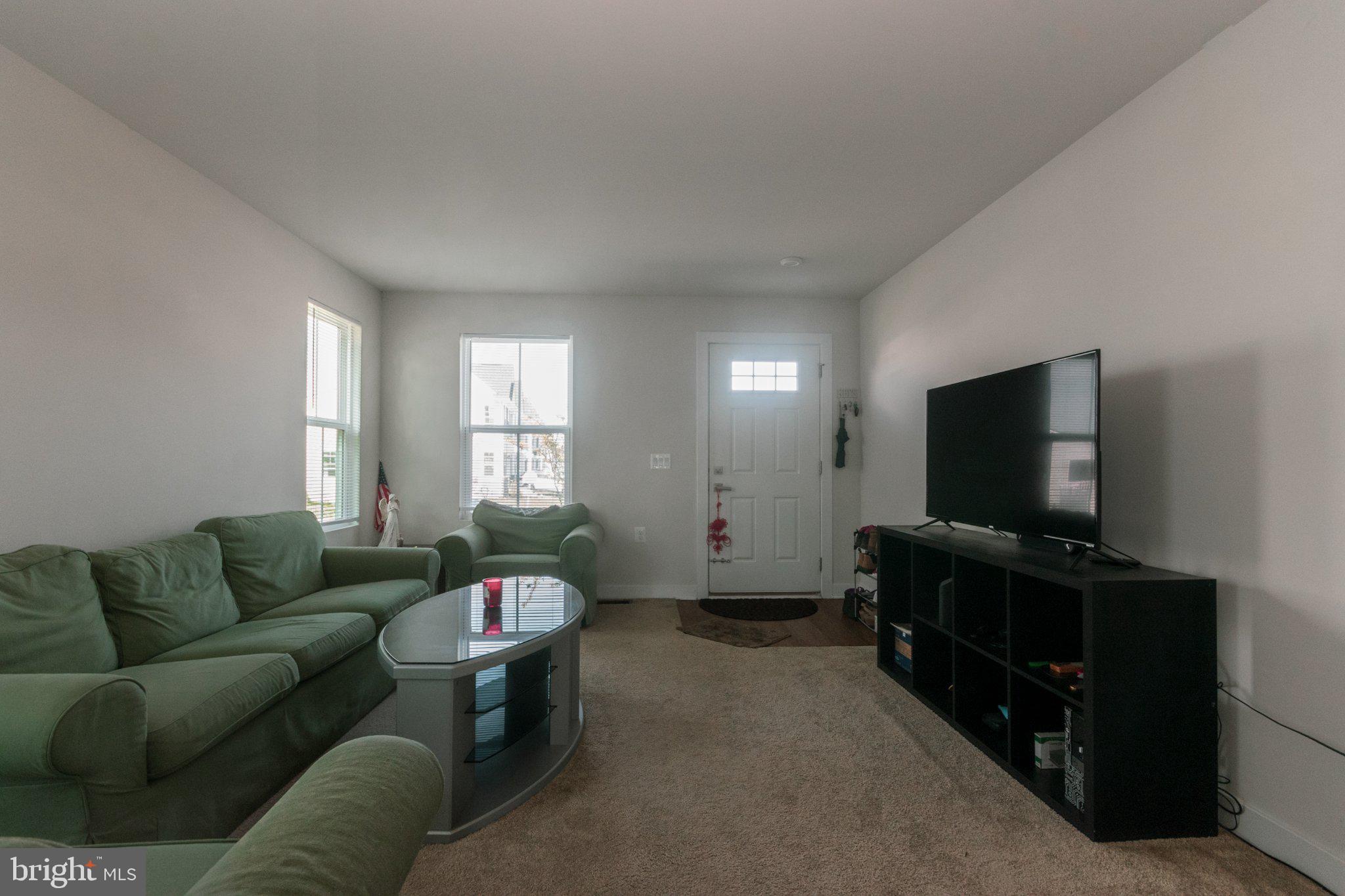 109 Blantons Road Martinsburg, WV 25405 - Photo 11 of 55 a living room with furniture and a flat screen tv
